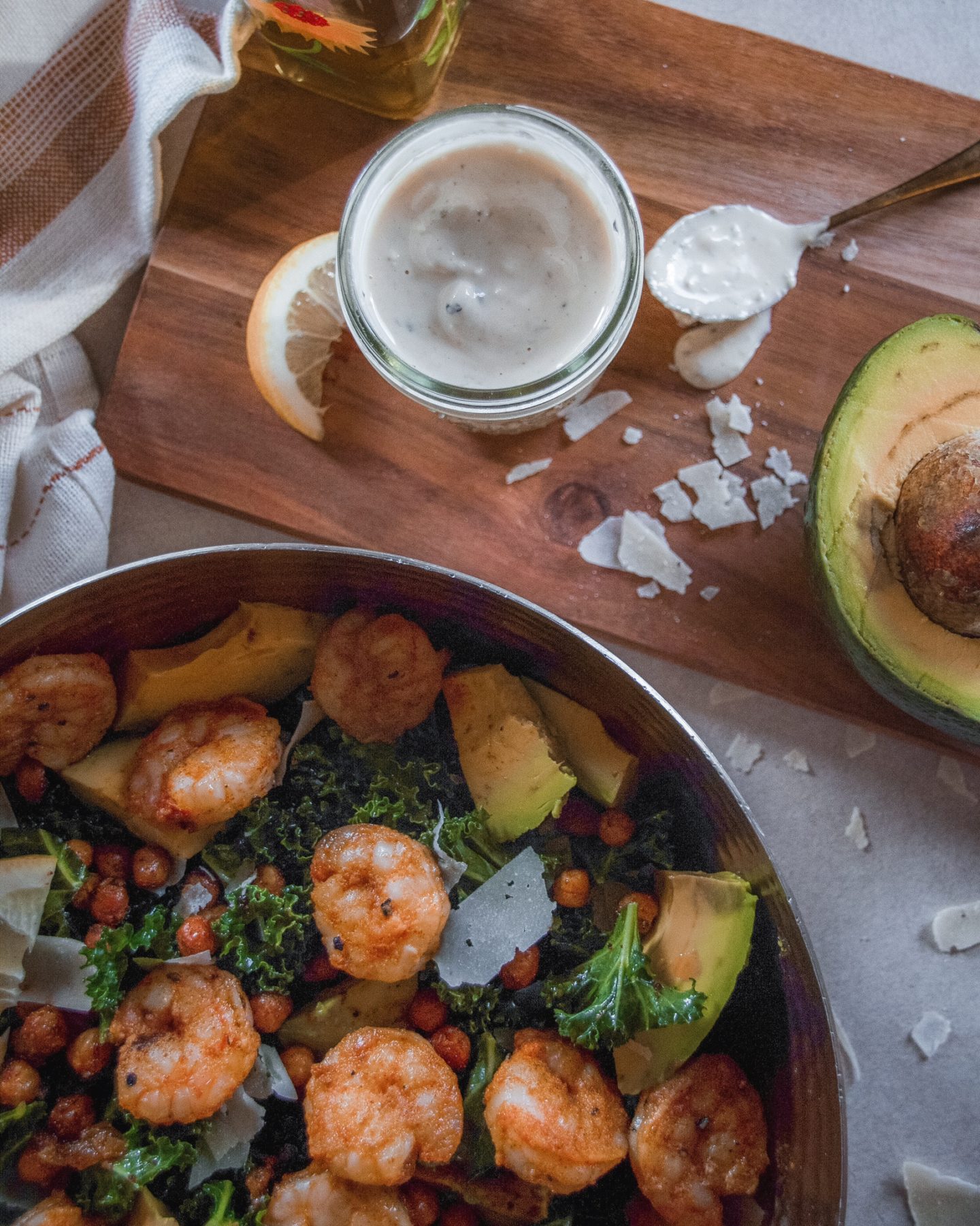 Shrimp and chickpea kale salad with tahini caesar dressing. 